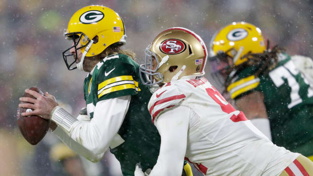 Arik Armstead of the San Francisco 49ers sacks the Green Bay Packers Aaron Rodgers